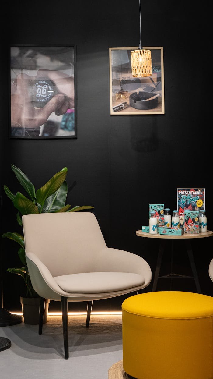 Contemporary trade show booth featuring stylish chairs, branded decor, and product display for networking.